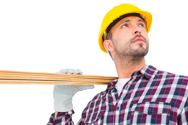 Handyman holding wood planks — Stock Photo, Image