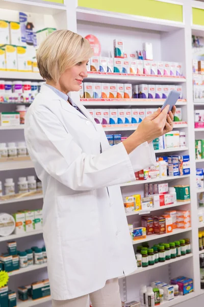 Smiling pharmacist using tablet pc — Stock Photo, Image