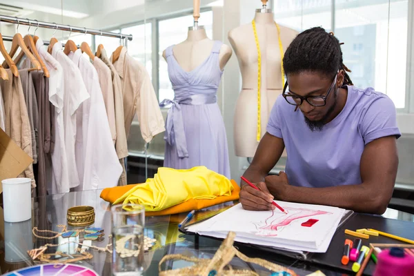 Attractive male fashion designer sketching — Stock Photo, Image