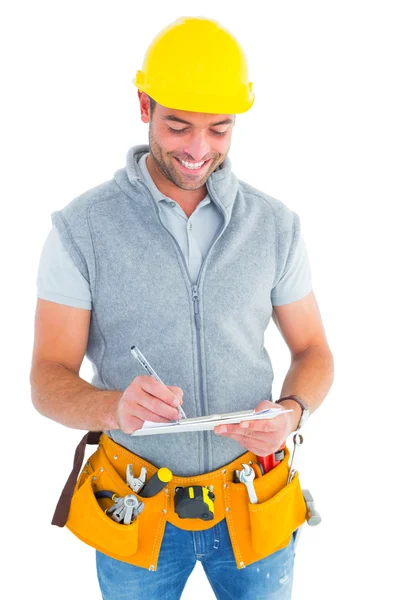 Repairman writing on clipboard — Stock Photo, Image