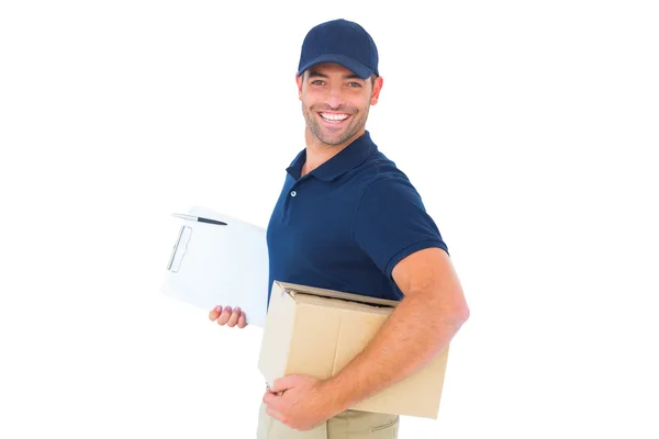 Delivery man with cardboard box and clipboard — Stock Photo, Image