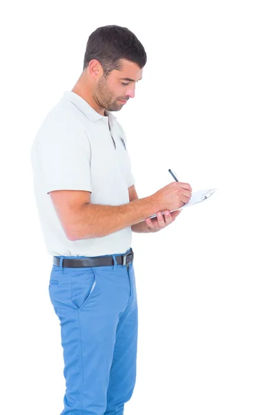 Supervisor escrevendo na área de transferência — Fotografia de Stock