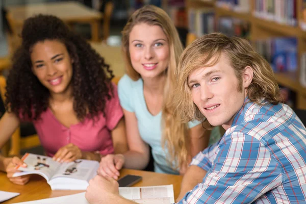 College students doing homework in library — Stock Photo, Image