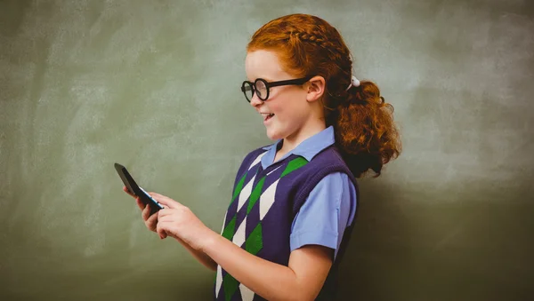 Side view of cute little girl holding calculator — Stock Photo, Image