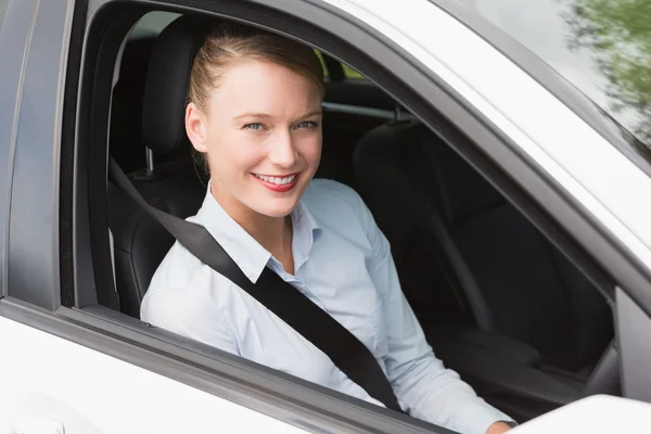 Happy businesswoman in the drivers seat — Stock Photo, Image