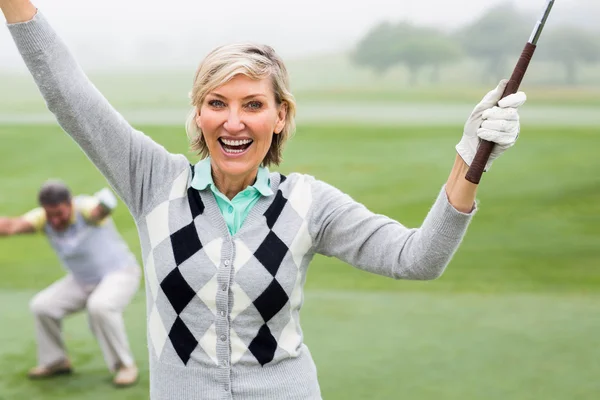 Lady golfer cheering at camera — Stock Photo, Image