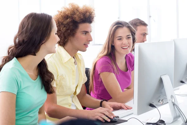 Smiling students in computer class — Stock Photo, Image