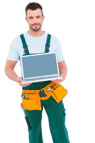 Happy construction worker holding laptop — Stock Photo, Image