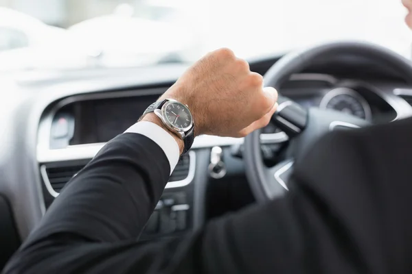 Businessman in drivers seat — Stock Photo, Image