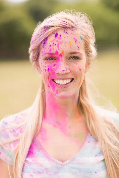 Happy blonde covered in powder paint — Stock Photo, Image