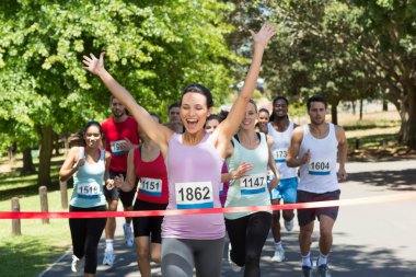 Fit people running race in park clipart