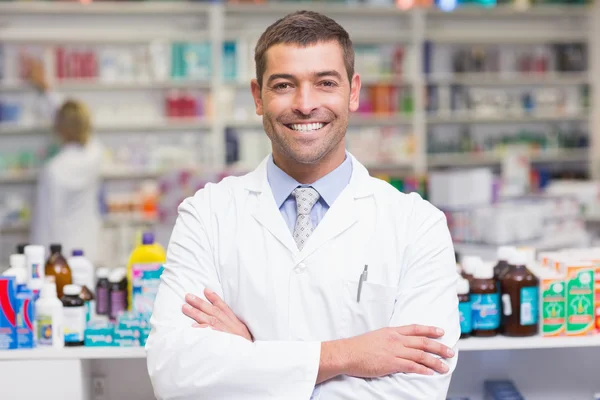 Pharmacist in lab coat looking at camera — Stock Photo, Image