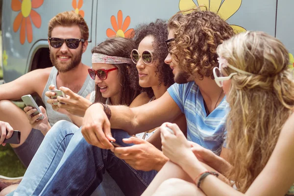 Hipster friends using their phones — Stock Photo, Image