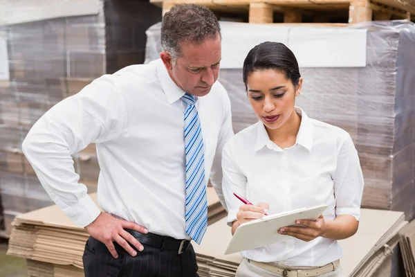 Warehouse manager and boss working together — Stock Photo, Image
