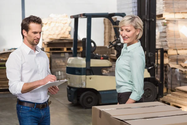 Two warehouse managers checking inventory — Stock Photo, Image