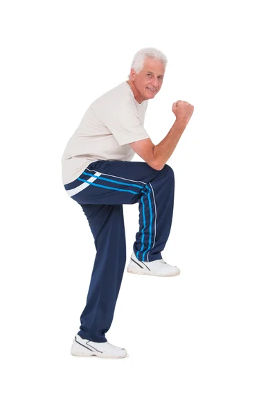 Senior man smiling and working out — Stock Photo, Image