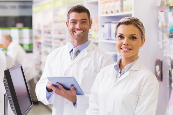Team of pharmacists looking at camera — Stock Photo, Image