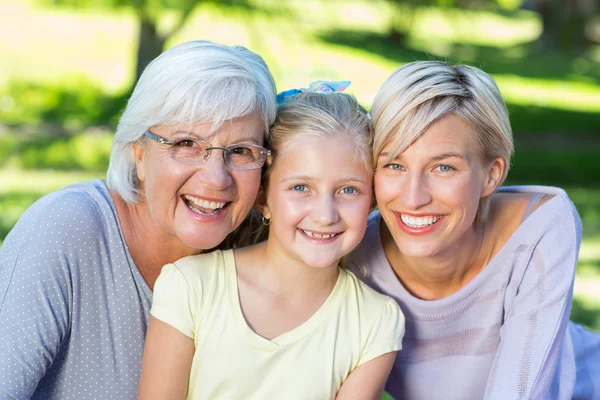 Smiling family looking at the camera — Stock Photo, Image