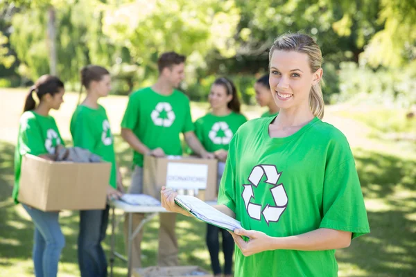 Happy environmental activists in the park — Stock Photo, Image