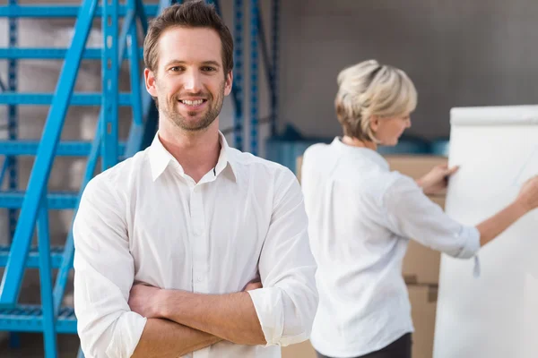 Warehouse manager smiling at camera — Stock Photo, Image