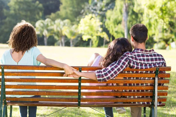 Lonely woman sitting with couple — Stock Photo, Image