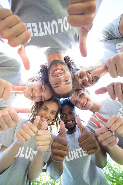 Happy volunteers in the park — Stock Photo, Image