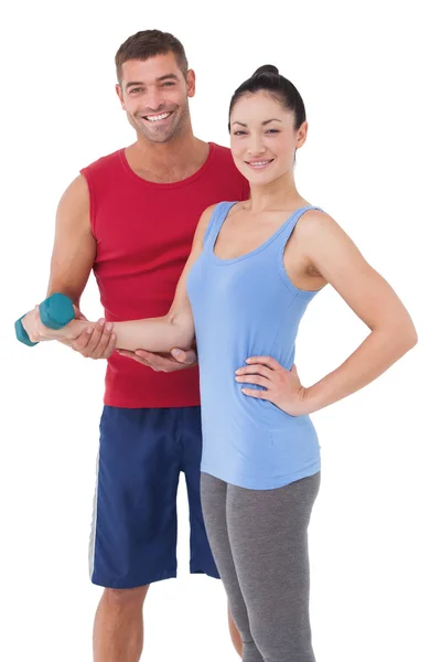 Fit woman and trainer smiling — Stock Photo, Image