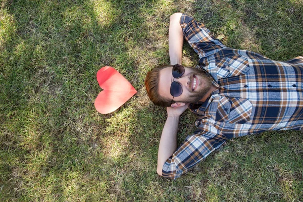 Handsome hipster relaxing in the park — Stock Photo, Image