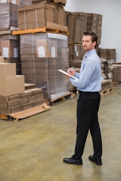 Warehouse manager looking at camera — Stock Photo, Image