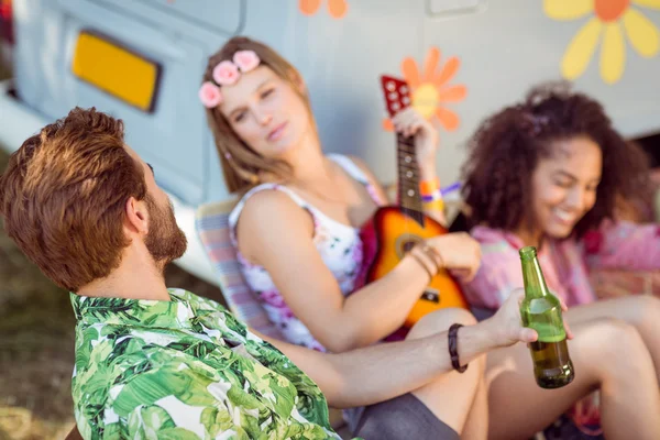 Happy hipsters relaxing on campsite — Stock Photo, Image