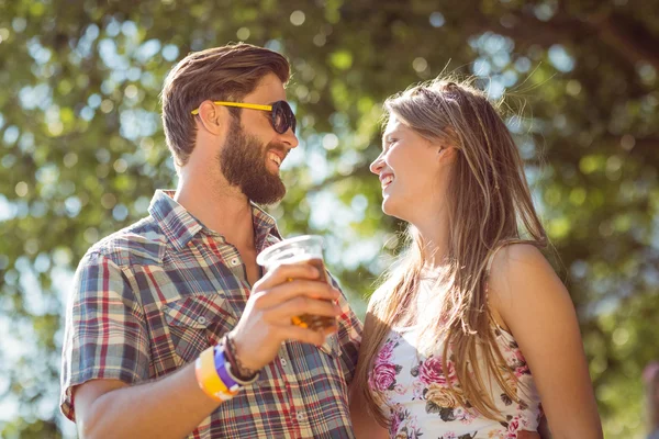 Hipster couple smiling at each other — Stock Photo, Image