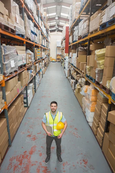 Worker holding hard hat and clipboard — Stock Photo, Image