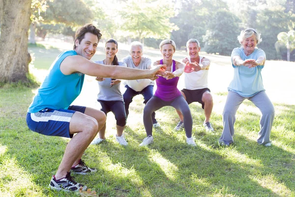 Happy athletic group training — Stock Photo, Image