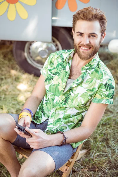 Handsome hipster using his smart phone — Stock Photo, Image