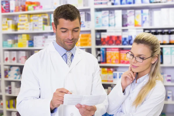 Team of pharmacists and talking — Stock Photo, Image