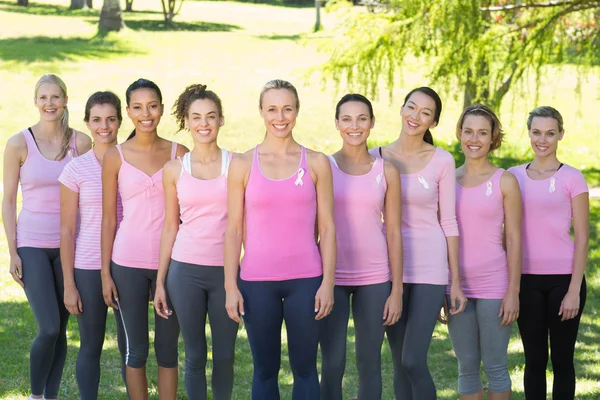 Smiling women in pink for breast cancer awareness — Stock Photo, Image