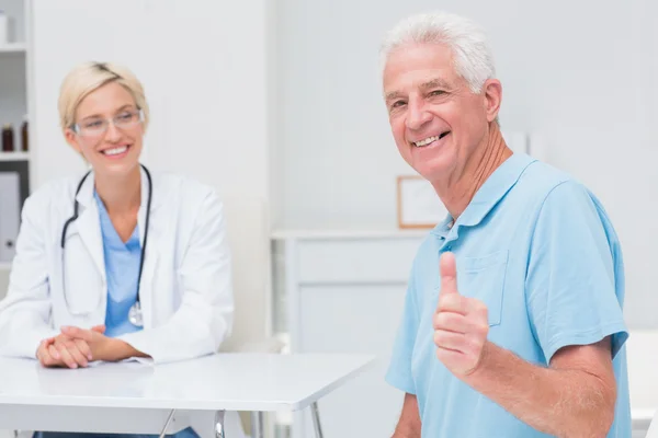 Senior patient gesturing thumbs up Stock Picture