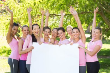 Smiling women in pink for breast cancer awareness clipart
