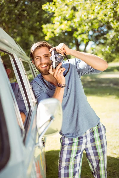 Handsome hipster taking a photo — Stock Photo, Image