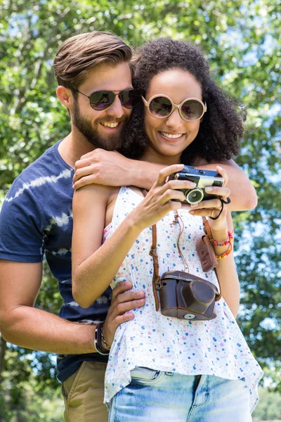 Hipster couple looking at their camera — Stock Photo, Image