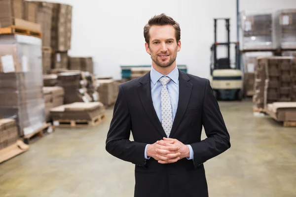 Warehouse manager standing hands together — Stock Photo, Image