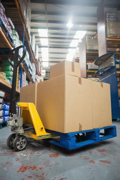Boxes on trolley in warehouse — Stock Photo, Image