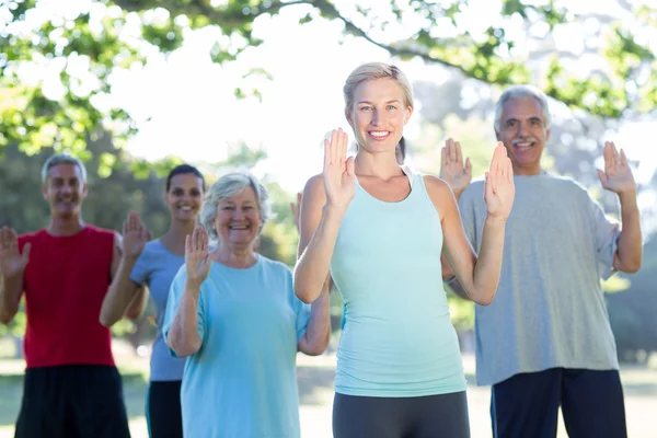Happy athletic group showing their hands — Stock Photo, Image