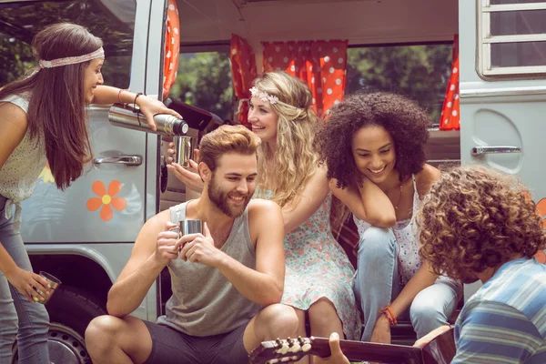 Hipster friends in camper van at festival — Stock Photo, Image