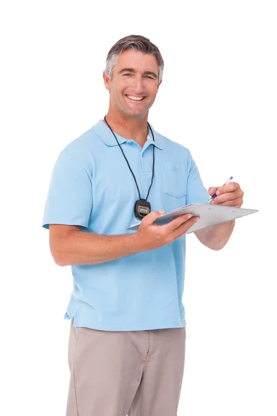 Entrenador sonriendo a la cámara — Foto de Stock