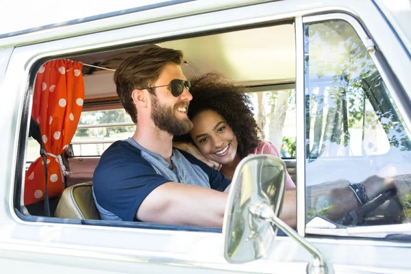 Hipster couple driving in camper van — Stock Photo, Image