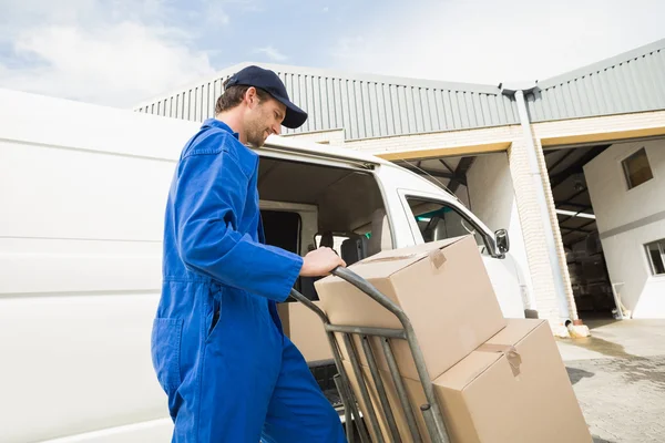 Delivery driver packing his van — Stock Photo, Image