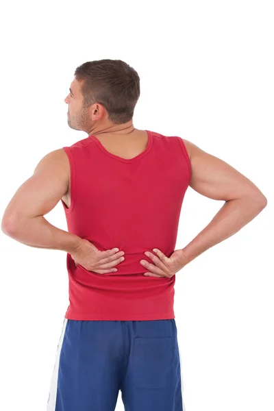 Fit man with injured back — Stock Photo, Image