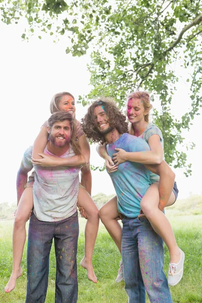 Friends having fun with powder paint — Stock Photo, Image