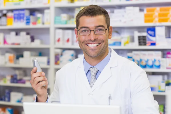 Happy pharmacist on the phone — Stock Photo, Image